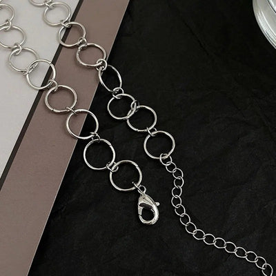 Anastasia Cut-Out Hoop Choker - A close-fitting choker style necklace featuring a series of interlinked hollow hoop charms, plus a cute butterfly.