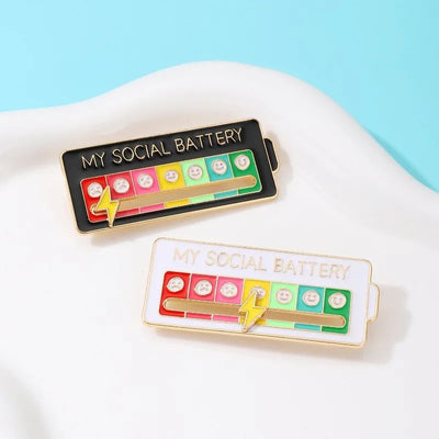 My Social Battery Enamel Brooch - A cute enamel brooch with a sliding scale indicating moods, and a little lightning bolt that can be moved along to indicate the wearer's current mood.