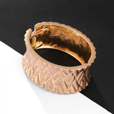 Phaedra Hinged Cuff Bangle - A beautiful gold cuff bangle with a basket weave pattern.