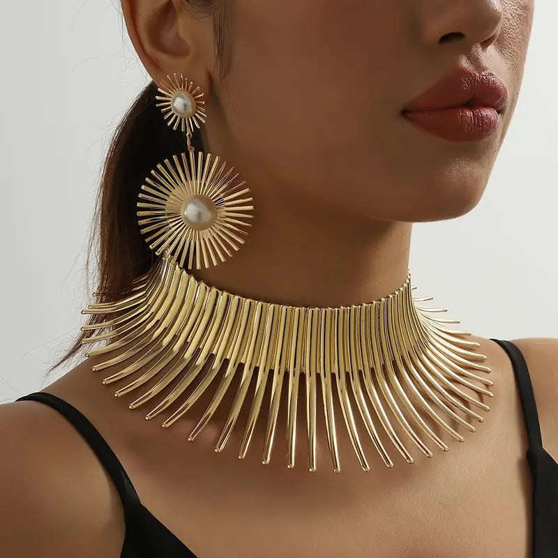 Solaris Radiant Statement Set - A pair of matching earrings and collar featuring long metal rays radiating out from a centre point, like solar rays.