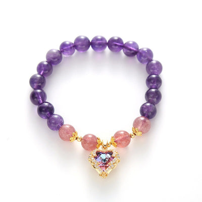 Violette Amethyst Stretch Bracelet - An elegant bracelet made from round purple and pink beads with a heart-shaped topaz as the centre piece.
