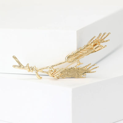 Cailleach Grain Sheath Brooch - An elegant crystal brooch shaped like a pair of wheat stalks bound by a delicate thread.