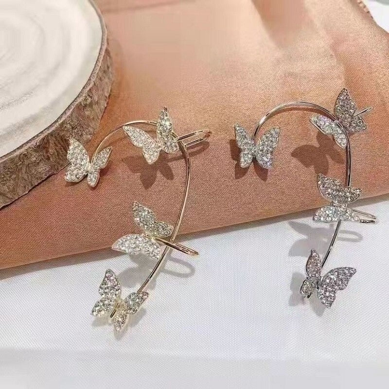 Lana Butterfly Ear Cuff - A sparkly, gemstone-encrusted ear cuff with a butterfly motif. 