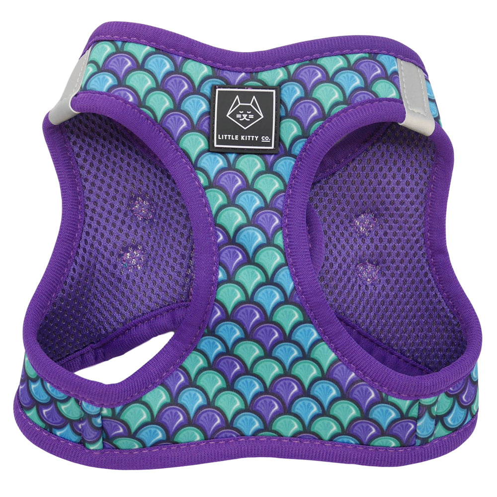Little Kitty Co. Cat Step-In Harness - Scaled Back (Limited Edition) - A full chest cat harness with a fun mermaid or fish scale print. It has purple mesh lining and purple trim, but the print itself is a tasteful mixture of purple, blue, and green. 