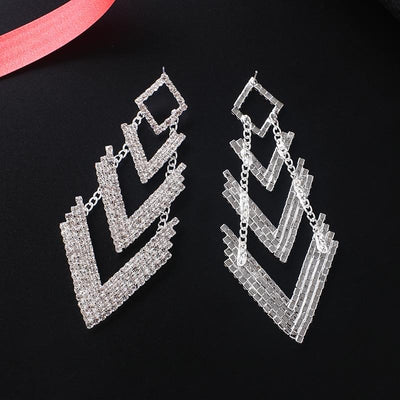 Achira Luxury Crystal Earrings - Huge crystal earrings shaped like a downward facing arrow. Very big, and very blingy!