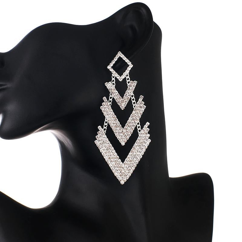 Achira Luxury Crystal Earrings - Huge crystal earrings shaped like a downward facing arrow. Very big, and very blingy!