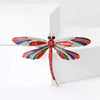 Aethera Dragonfly Brooch - A large, colourful dragonfly themed brooch with vibrant enamel paint and sparkling crystals.