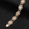 Alessandra Cut-Out Link Bracelet - An elegant rose gold bracelet made up of seven stylised eye-shaped panels linked with chain links.