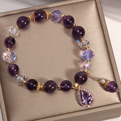 Amaranthe Amethyst Stretch Bracelet - An elegant bracelet made from round amethyst, rose quartz, and clear quartz beads with a teardrop-shaped amethyst as the centre piece.