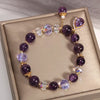 Amaranthe Amethyst Stretch Bracelet - An elegant bracelet made from round amethyst, rose quartz, and clear quartz beads with a teardrop-shaped amethyst as the centre piece.