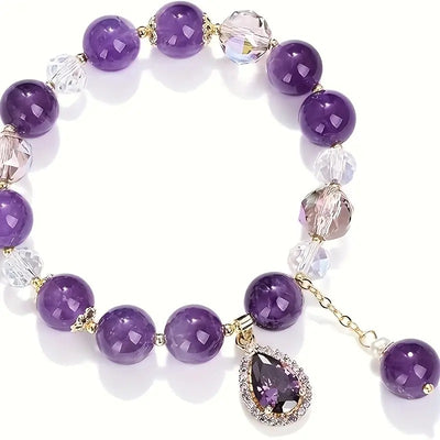 Amaranthe Amethyst Stretch Bracelet - An elegant bracelet made from round amethyst, rose quartz, and clear quartz beads with a teardrop-shaped amethyst as the centre piece.