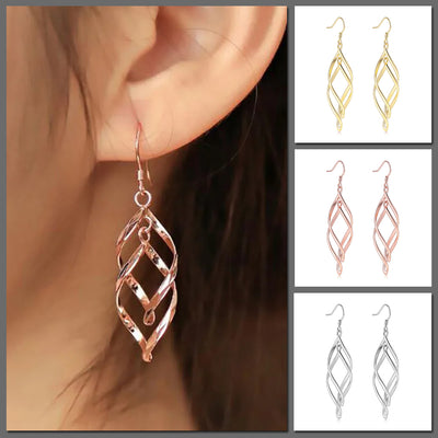 Amita Infinite Twist Dangle Earrings - Medium-sized elegant spiral twist earrings in yellow, rose, or white gold.