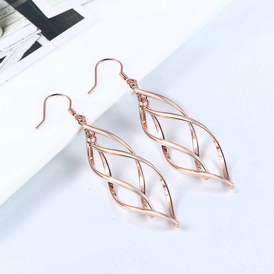 Amita Infinite Twist Dangle Earrings - Medium-sized elegant spiral twist earrings in yellow, rose, or white gold.