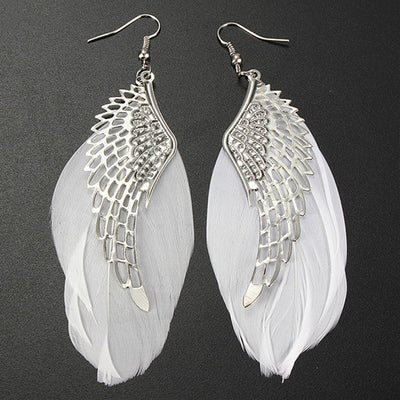 The Angel Feather Earrings - Large feathered earrings available in white, black, red, purple, and blue.