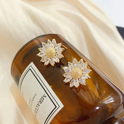 Annette Crystal Daisy Stud Earrings - Small round crystal earrings made to resemble cute little stylised sunflowers, with a pitted metal centre surrounded by crystal petals.