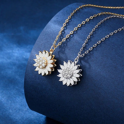 Annie Sunflower Fidget Spinner Necklace - A tiny round crystal pendant designed to look like a stylised sunflower, which features a rotating plate so it can be twirled for a calming meditative effect.