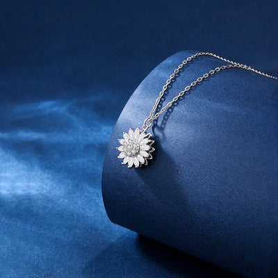 Annie Sunflower Fidget Spinner Necklace - A tiny round crystal pendant designed to look like a stylised sunflower, which features a rotating plate so it can be twirled for a calming meditative effect.