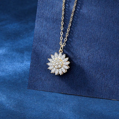 Annie Sunflower Fidget Spinner Necklace - A tiny round crystal pendant designed to look like a stylised sunflower, which features a rotating plate so it can be twirled for a calming meditative effect.