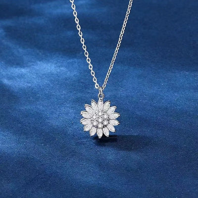 Annie Sunflower Fidget Spinner Necklace - A tiny round crystal pendant designed to look like a stylised sunflower, which features a rotating plate so it can be twirled for a calming meditative effect.