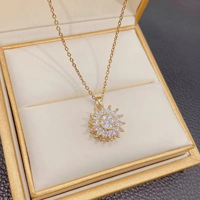 Annie Sunflower Fidget Spinner Necklace - A tiny round crystal pendant designed to look like a stylised sunflower, which features a rotating plate so it can be twirled for a calming meditative effect.