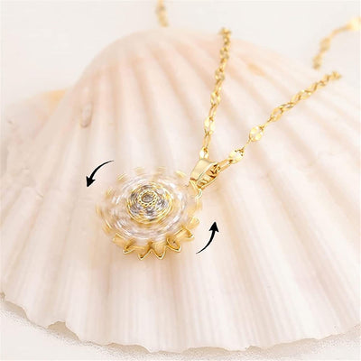 Annie Sunflower Fidget Spinner Necklace - A tiny round crystal pendant designed to look like a stylised sunflower, which features a rotating plate so it can be twirled for a calming meditative effect.