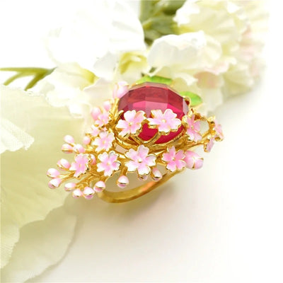 The Anthousai Ring - A lovely vibrant floral ring with a large coloured crystal surrounded by tiny enamel flowers and leaves.