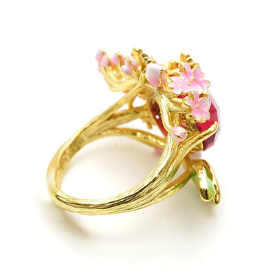 The Anthousai Ring - A lovely vibrant floral ring with a large coloured crystal surrounded by tiny enamel flowers and leaves.