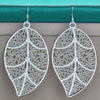 Aranyani Stylised Leaf Earrings - A pair of beautiful, sterling silver plated leaf charms suspended from french hooks.