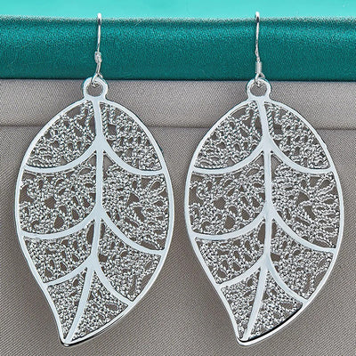 Aranyani Stylised Leaf Earrings - A pair of beautiful, sterling silver plated leaf charms suspended from french hooks.