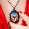 Batty Bat Cameo Necklace - A large gothic glass cabochon featuring an image of a stylized bat against an orange-blue ombre background.