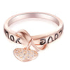 Be Still My Heart Ring - A rose gold ring with a heart and ribbon theme.