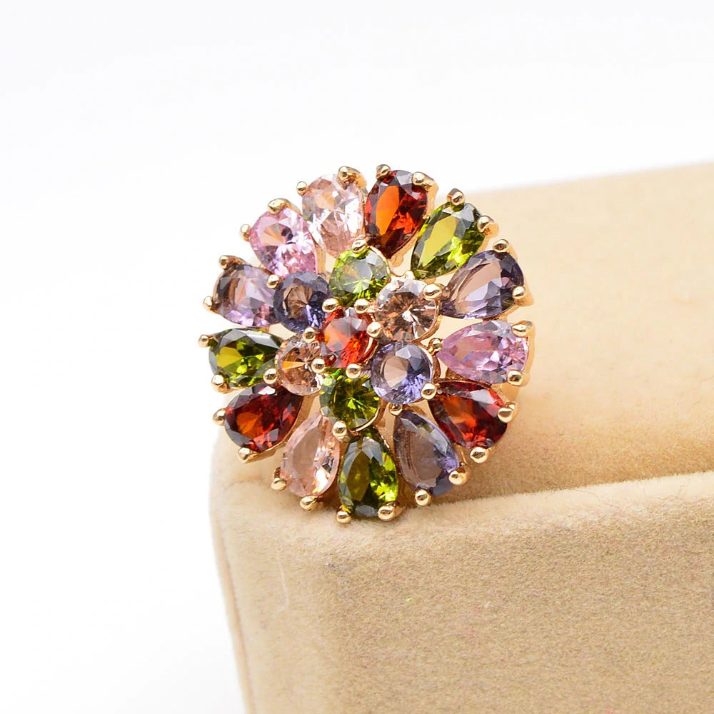 Bijoux Explosion I Brooch - A small but radiant circular brooch made of multi-coloured crystals in a burst of colour.