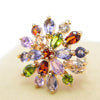 Bijoux Explosion I Brooch - A small but radiant circular brooch made of multi-coloured crystals in a burst of colour.