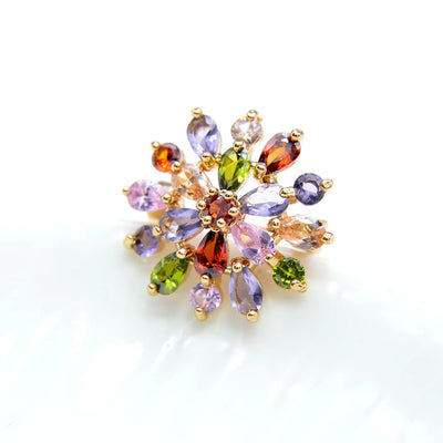 Bijoux Explosion I Brooch - A small but radiant circular brooch made of multi-coloured crystals in a burst of colour.