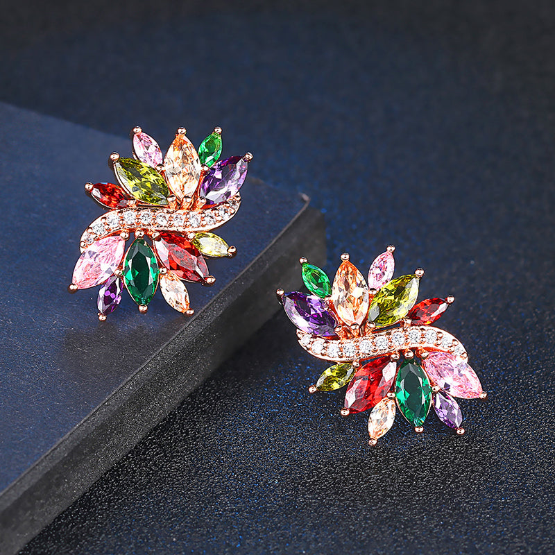 Bijoux Flourish Crystal Stud Earrings - Large stud earrings featuring an assortment of crystals in different colours to create a rainbow effect, with a strand of rose gold and white quartz running through them like a flourish. 