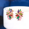 Bijoux Flourish Crystal Stud Earrings - Large stud earrings featuring an assortment of crystals in different colours to create a rainbow effect, with a strand of rose gold and white quartz running through them like a flourish.