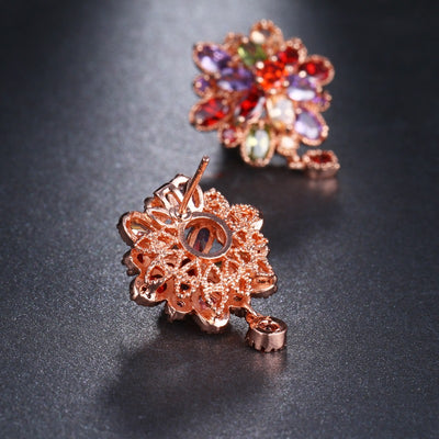 Bijoux Kaleidoscope Cluster Earrings - A medium-sized round cluster earring made of lots of smaller stones clustered around a centre stone, to resemble a flower or starburst.