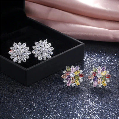 Bijoux Kaleidoscope Cluster Earrings - A medium-sized round cluster earring made of lots of smaller stones clustered around a centre stone, to resemble a flower or starburst.