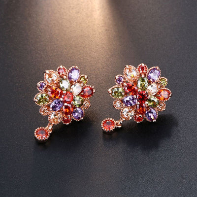 Bijoux Kaleidoscope Cluster Earrings - A medium-sized round cluster earring made of lots of smaller stones clustered around a centre stone, to resemble a flower or starburst.