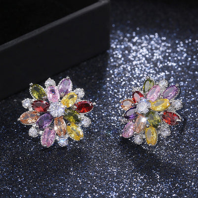 Bijoux Kaleidoscope Cluster Earrings - A medium-sized round cluster earring made of lots of smaller stones clustered around a centre stone, to resemble a flower or starburst.