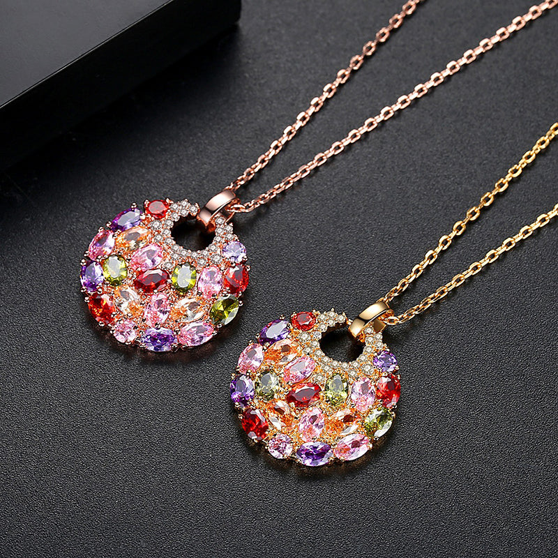 Bijoux Multi-Stone Crystal Disc Necklace - A lovely rose gold pendant studded with a rainbow of crystals.