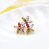 Bijoux Petite Posy Brooch - A tiny delicate brooch made of multi-coloured marquise-cut stones arranged to look like itty-bitty flowers.