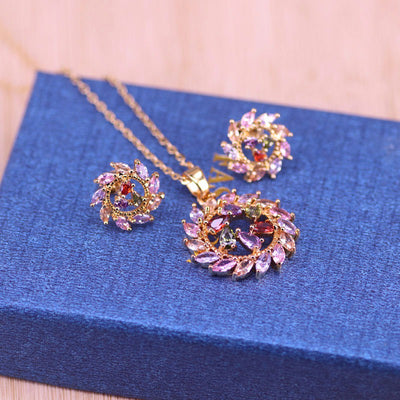 Bijoux Rosette Nebula Pendant & Earrings Set - A jewellery set consisting of a matching necklace and pendant, featuring multi-coloured crystals set in contrasting circular patterns that resemble a nebula.
