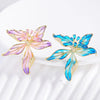 Brigette Orchid Sculpted Resin Brooch - An elegant floral brooch available in blue, pink, or purple, with shimmering crystals and semi-translucent resin.