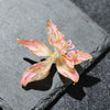 Brigette Orchid Sculpted Resin Brooch - An elegant floral brooch available in blue, pink, or purple, with shimmering crystals and semi-translucent resin.