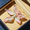 Brigette Orchid Sculpted Resin Brooch - An elegant floral brooch available in blue, pink, or purple, with shimmering crystals and semi-translucent resin.