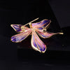 Brigette Orchid Sculpted Resin Brooch - An elegant floral brooch available in blue, pink, or purple, with shimmering crystals and semi-translucent resin.