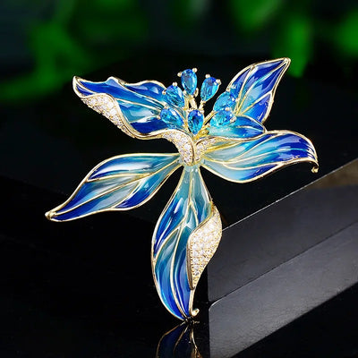 Brigette Orchid Sculpted Resin Brooch - An elegant floral brooch available in blue, pink, or purple, with shimmering crystals and semi-translucent resin.