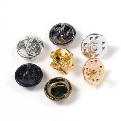 Brooch Pin & Cap Sets - An assortment of small brooch pin backs used in the creation of jewellery.