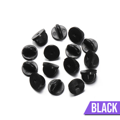Loose Brooch Pin Backs - A pile of rubber brooch backs in black.